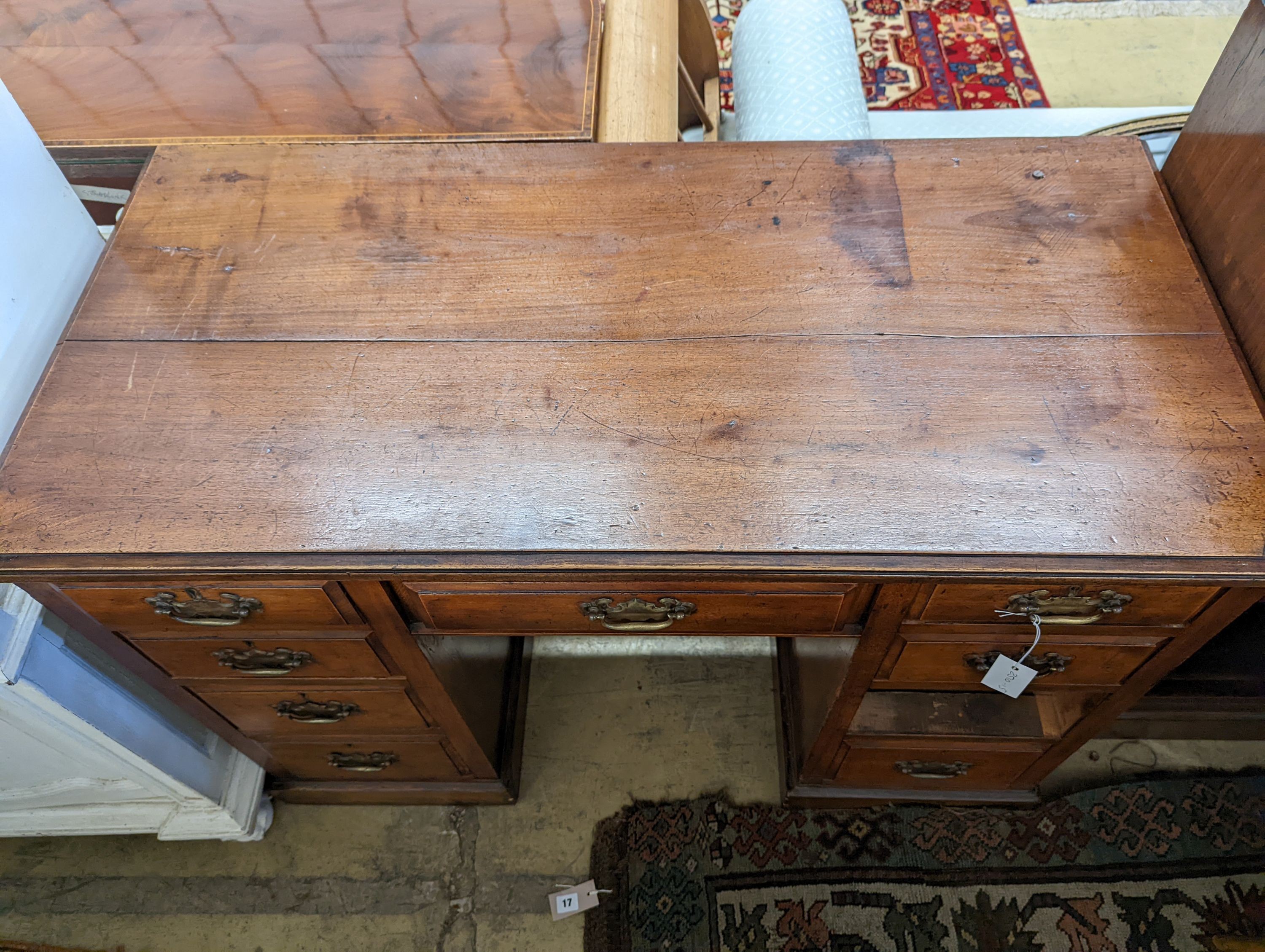 A late Victorian mahogany walnut kneehole desk, length 114cm, depth 55cm, height 78cm